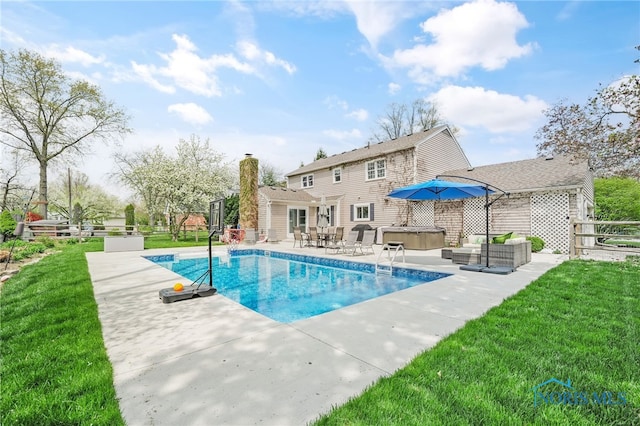 pool with a patio, a lawn, an outdoor hangout area, and a hot tub