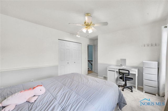 bedroom featuring carpet flooring, a closet, a ceiling fan, visible vents, and baseboards