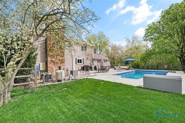 pool featuring a patio, central air condition unit, a lawn, and fence