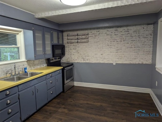 kitchen featuring stainless steel electric range oven, black microwave, a sink, dark wood finished floors, and blue cabinetry