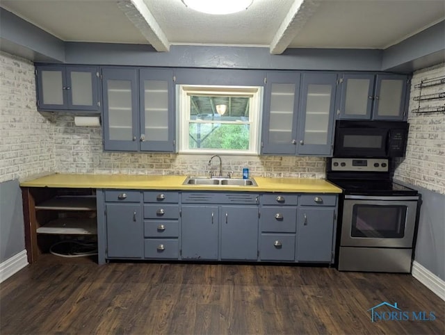 kitchen with black microwave, a sink, light countertops, gray cabinets, and electric stove