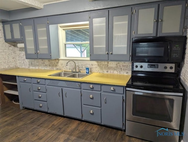 kitchen with gray cabinets, electric range, black microwave, dark wood finished floors, and a sink