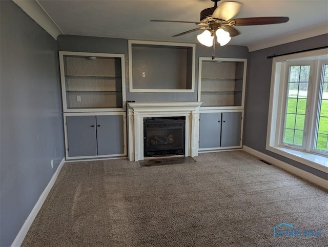 unfurnished living room featuring baseboards, a ceiling fan, a fireplace with flush hearth, and carpet flooring