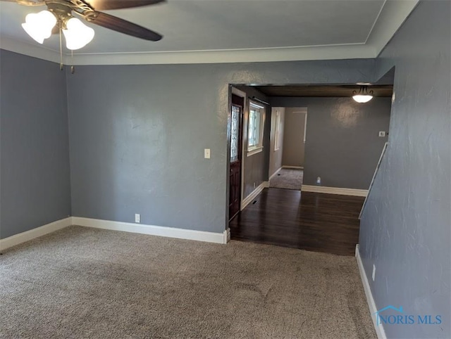 unfurnished room with baseboards, a ceiling fan, and carpet flooring