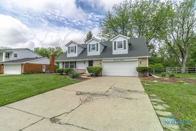 2214 Thornridge Dr, Toledo, OH 43614 - cape cod home featuring concrete driveway, brick siding, a garage, and a shingled roof