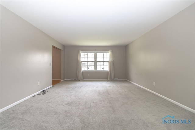 2214 Thornridge Dr, Toledo, OH 43614 - unfurnished room with baseboards and carpet