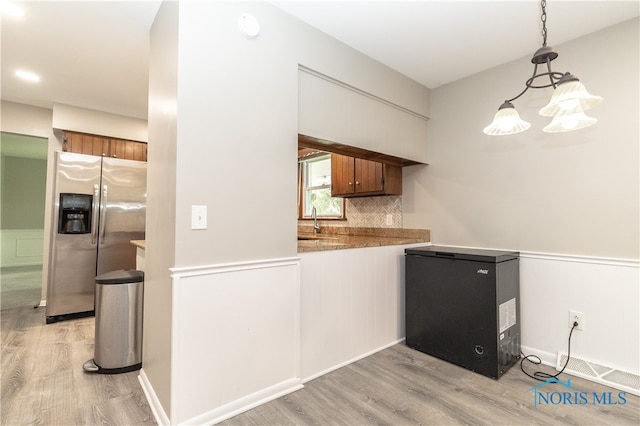2214 Thornridge Dr, Toledo, OH 43614 - kitchen featuring stainless steel fridge, fridge, light wood-type flooring, and backsplash
