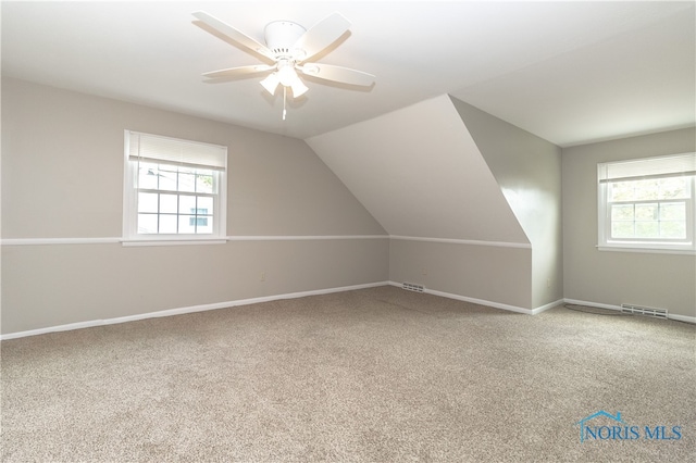2214 Thornridge Dr, Toledo, OH 43614 - additional living space with plenty of natural light, carpet floors, baseboards, and lofted ceiling