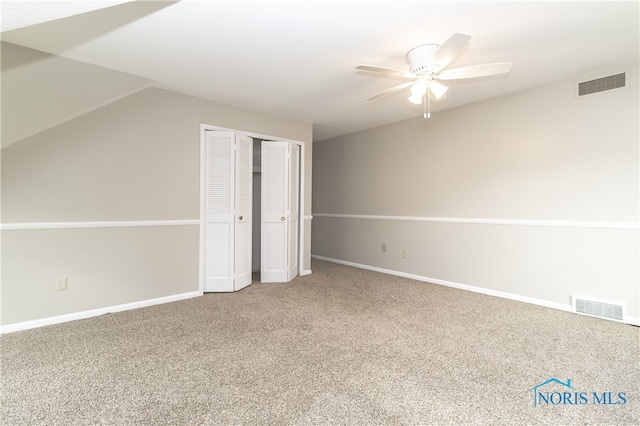 2214 Thornridge Dr, Toledo, OH 43614 - unfurnished bedroom with carpet, a closet, vaulted ceiling, and baseboards