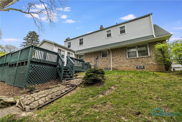 2214 Thornridge Dr, Toledo, OH 43614 - back of property with a deck, a lawn, a chimney, and brick siding
