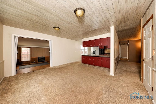 536 Edinborough Dr, Findlay, OH 45840 - kitchen featuring dark countertops, wooden ceiling, light carpet, black oven, and baseboards