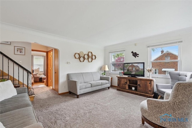 5583 304th St, Toledo, OH 43611 - living area featuring stairway, baseboards, arched walkways, and carpet floors