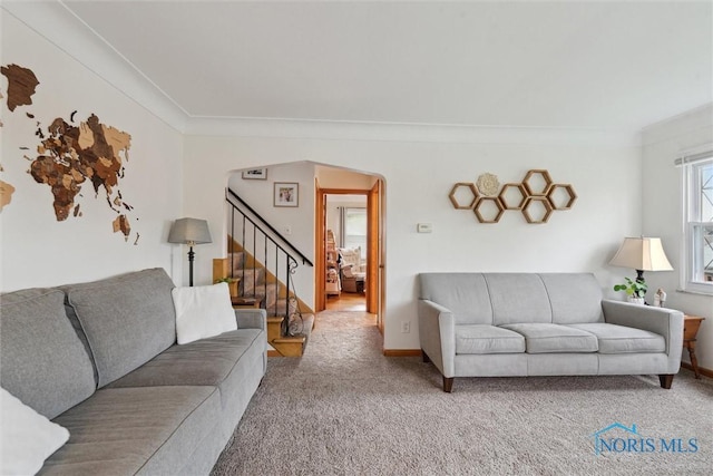 5583 304th St, Toledo, OH 43611 - carpeted living area with arched walkways, stairs, ornamental molding, and baseboards