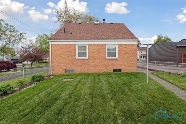 5583 304th St, Toledo, OH 43611 - back of house with a yard, brick siding, and fence private yard