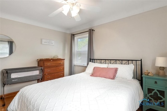 5583 304th St, Toledo, OH 43611 - bedroom featuring a ceiling fan and wood finished floors
