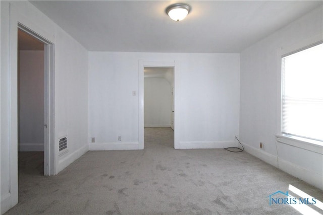 304 Dexter St, Toledo, OH 43608 - spare room featuring baseboards, visible vents, and carpet