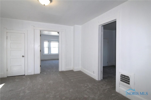304 Dexter St, Toledo, OH 43608 - carpeted empty room with baseboards and visible vents