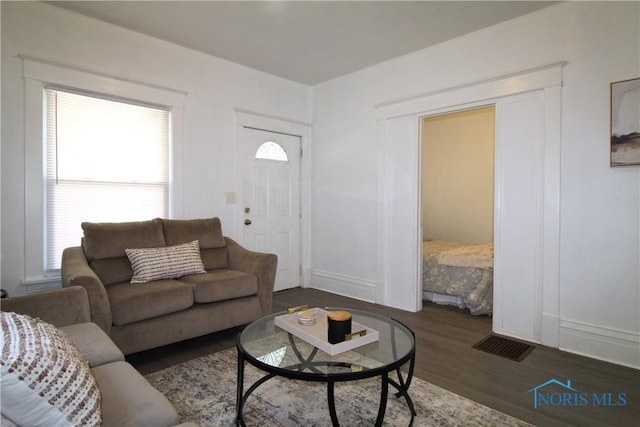 304 Dexter St, Toledo, OH 43608 - living area with plenty of natural light, visible vents, and wood finished floors