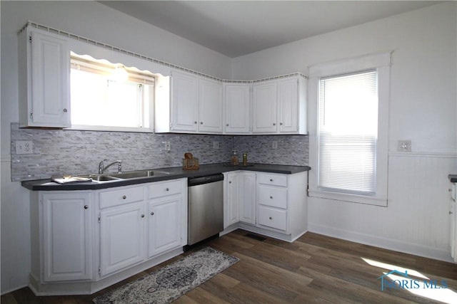 304 Dexter St, Toledo, OH 43608 - kitchen featuring dark countertops, dishwasher, white cabinetry, and a sink