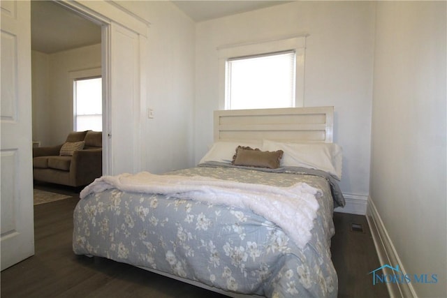 304 Dexter St, Toledo, OH 43608 - bedroom featuring dark wood-type flooring and baseboards