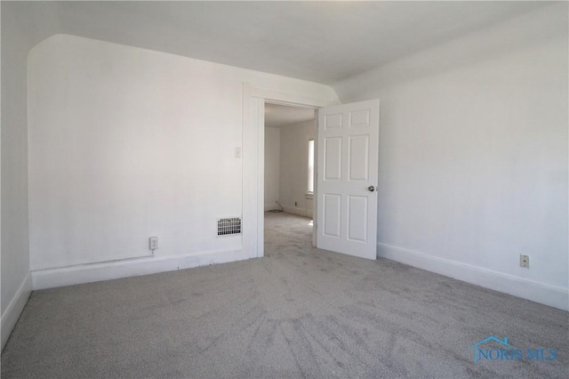 304 Dexter St, Toledo, OH 43608 - unfurnished room with baseboards, visible vents, and carpet