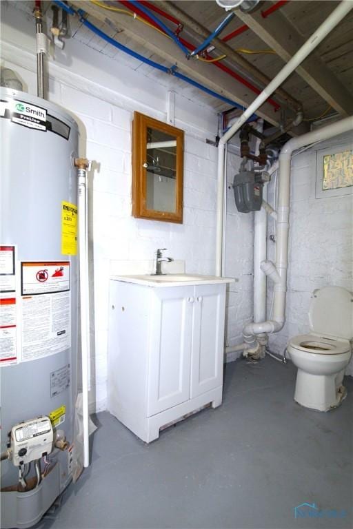 304 Dexter St, Toledo, OH 43608 - unfinished below grade area featuring water heater, concrete block wall, and a sink