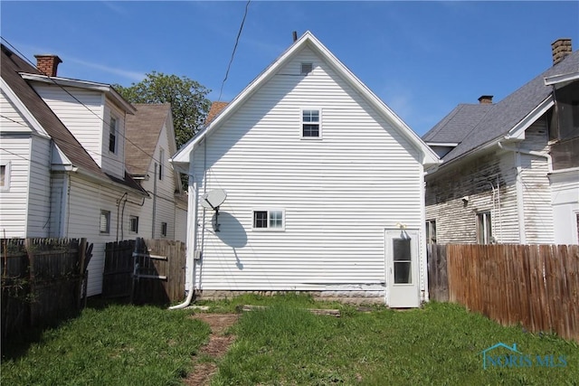 304 Dexter St, Toledo, OH 43608 - exterior space featuring a lawn and fence