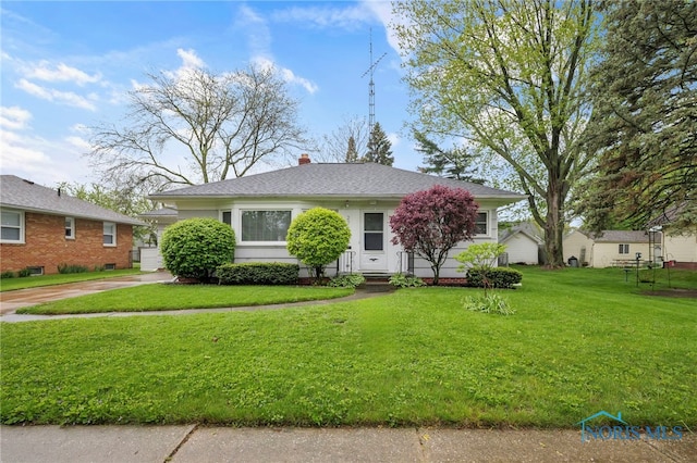 2710 131st St, Toledo, OH 43611 - view of front of house featuring a front lawn and a chimney