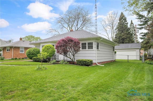 2710 131st St, Toledo, OH 43611 - rear view of property with a shingled roof and a chimney