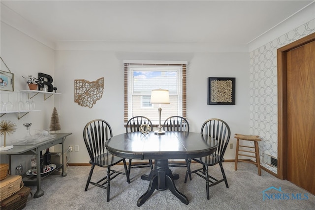 2710 131st St, Toledo, OH 43611 - dining area featuring light colored carpet, baseboards, and ornamental molding