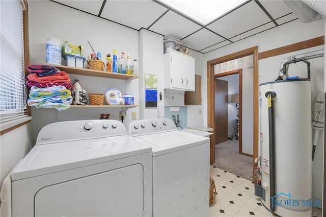 2710 131st St, Toledo, OH 43611 - laundry area featuring gas water heater, washing machine and dryer, cabinet space, and light flooring