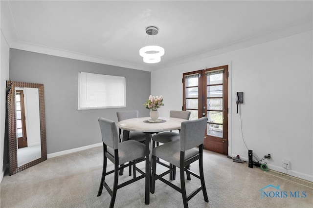 2923 Powhattan Pkwy, Toledo, OH 43606 - dining area featuring baseboards, ornamental molding, and light carpet
