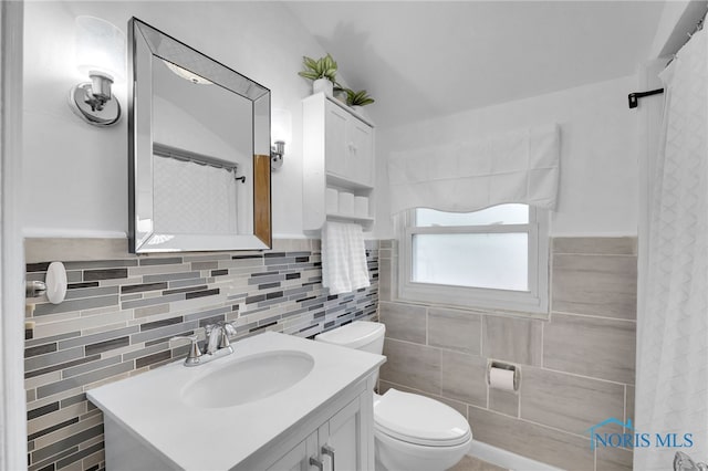 2923 Powhattan Pkwy, Toledo, OH 43606 - bathroom with tile walls, toilet, and vanity