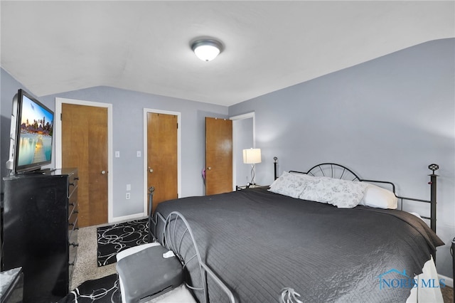 2923 Powhattan Pkwy, Toledo, OH 43606 - carpeted bedroom with vaulted ceiling and baseboards