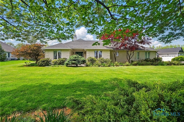 3145 Shoreland Ave, Toledo, OH 43611 - view of front of house with a front lawn and a chimney