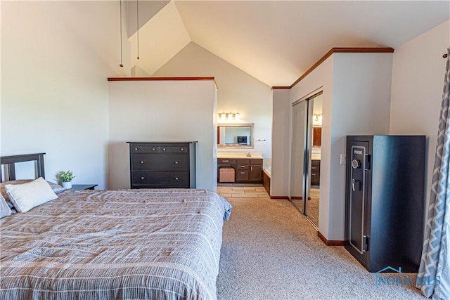 556 S Lathrop Rd, Swanton, OH 43558 - bedroom with ensuite bath, vaulted ceiling, and light carpet