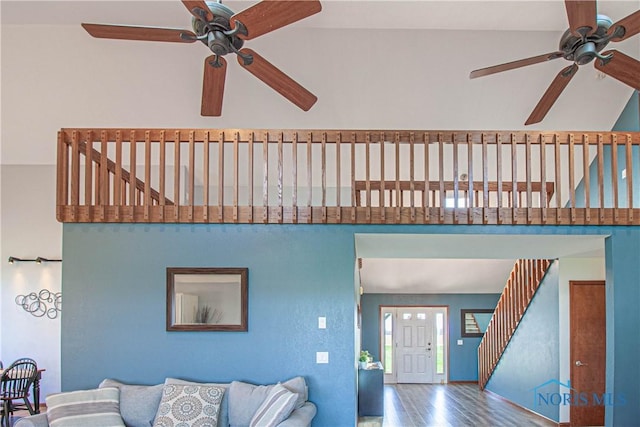 556 S Lathrop Rd, Swanton, OH 43558 - living room featuring stairs, ceiling fan, and wood finished floors