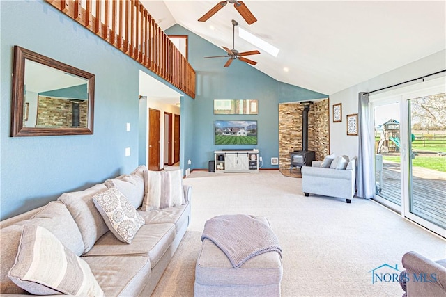 556 S Lathrop Rd, Swanton, OH 43558 - carpeted living room with ceiling fan, high vaulted ceiling, and a wood stove