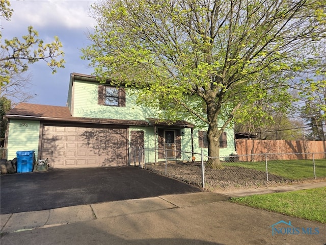 view of front of property featuring driveway and fence