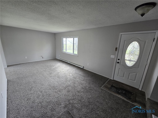 entrance foyer with a textured ceiling, baseboard heating, carpet, and baseboards