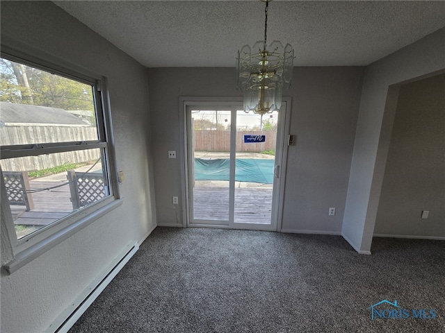 unfurnished dining area with a healthy amount of sunlight, a notable chandelier, a baseboard heating unit, and carpet flooring