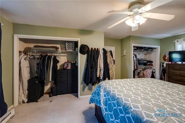 bedroom featuring baseboard heating, ceiling fan, and carpet