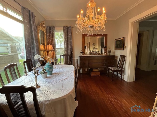 825 S Clinton St, Defiance, OH 43512 - dining area featuring crown molding, a notable chandelier, and dark wood-style floors