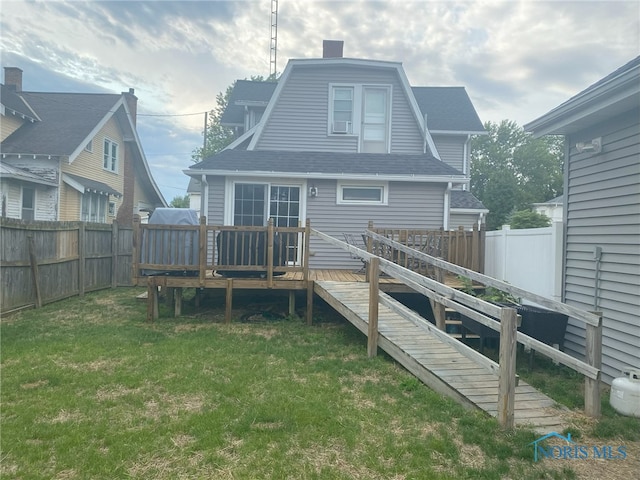 825 S Clinton St, Defiance, OH 43512 - rear view of property with a deck, a fenced backyard, and a chimney