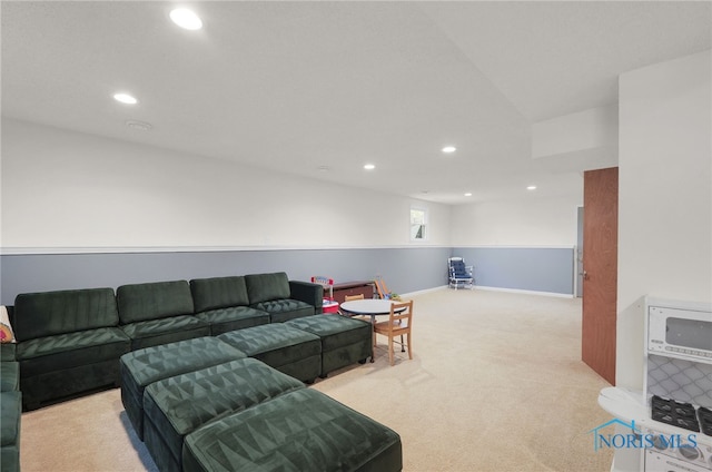 living room with baseboards, carpet, and recessed lighting