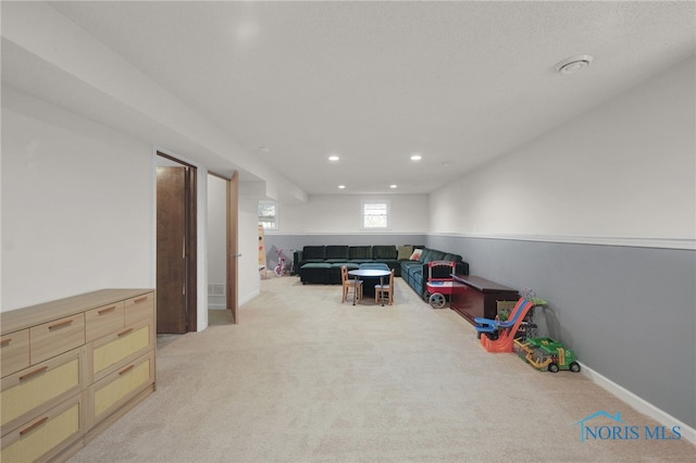 rec room with light colored carpet, recessed lighting, and baseboards