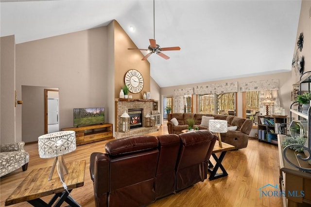 6170 S Winding Way, Swanton, OH 43558 - living room with a brick fireplace, a ceiling fan, high vaulted ceiling, and wood finished floors