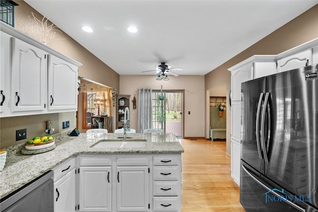 6170 S Winding Way, Swanton, OH 43558 - kitchen with a sink, stainless steel appliances, ceiling fan, a peninsula, and white cabinetry