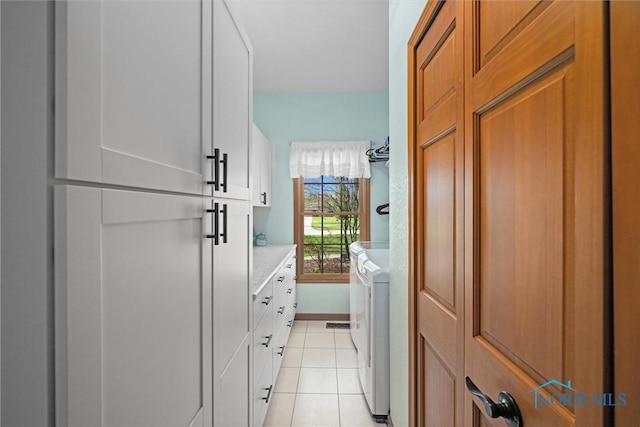 6170 S Winding Way, Swanton, OH 43558 - clothes washing area featuring cabinet space, light tile patterned flooring, and independent washer and dryer