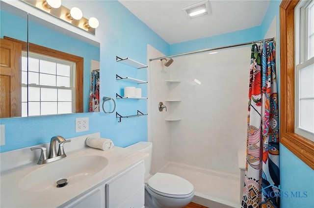 864 Cherry Ln, Waterville, OH 43566 - full bathroom featuring healthy amount of natural light, a shower with curtain, toilet, and vanity